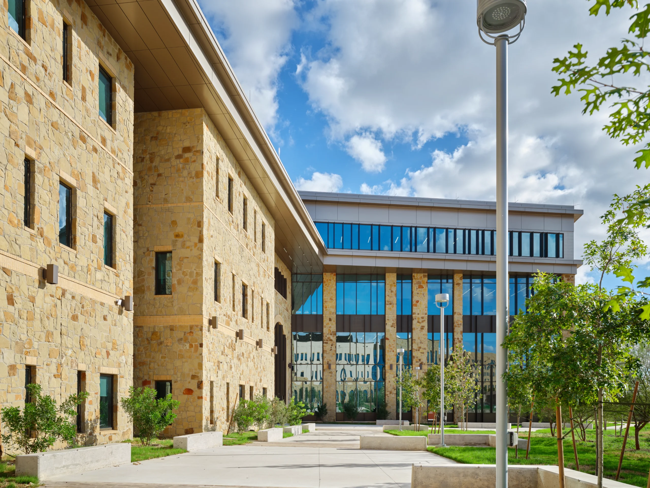 Brick building with banded glass facade in higher education professional school design