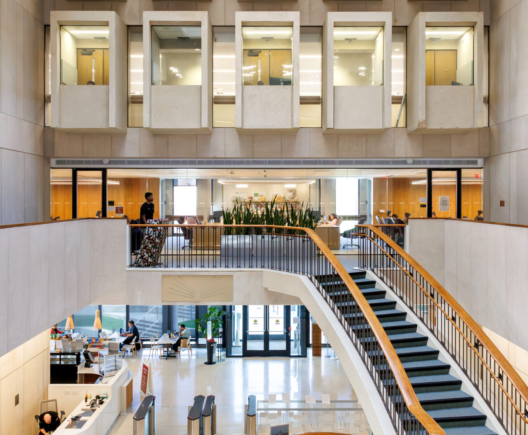 Accidentally Wes Anderson, CAP Brutalist concrete study carrels over a a multistory atrium